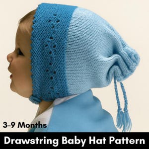 May include: A light blue and medium blue knitted baby hat with a drawstring and tassels. The hat has a scalloped edge and is designed for babies aged 3-9 months. The text "Drawstring Baby Hat Pattern" is at the bottom.