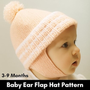 May include: A light peach-colored knitted baby ear flap hat with a pom-pom on top. The hat has a textured band and ear flaps. The text "3-9 Months" and "Baby Ear Flap Hat Pattern" are visible.