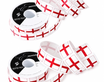 May include: White ribbon spools with a repeating pattern of the English flag, a red cross on a white background. The ribbon is from Berisfords Essentials. The spools are on a white background.