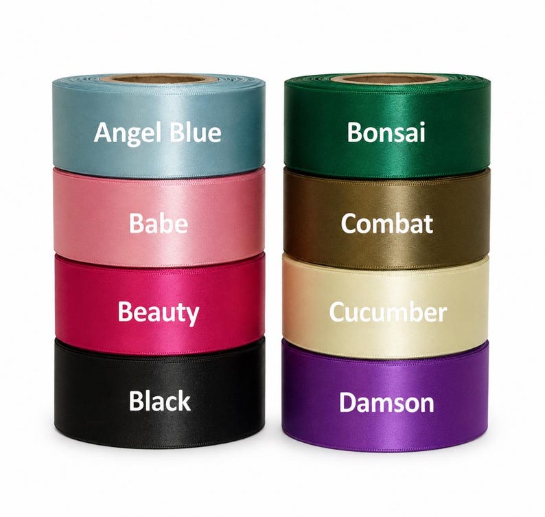 May include: Two stacks of satin ribbon rolls in various colors, including Angel Blue, Babe, Beauty, Black, Bonsai, Combat, Cucumber, and Damson. Each roll has a label with its color name in white text. The ribbons are arranged vertically.
