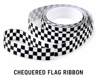May include: A roll of checkered flag ribbon in black and white. The ribbon is unrolled, with a portion of it lying flat and the rest coiled. The text "CHECKERED FLAG RIBBON" is printed in black at the bottom of the image.