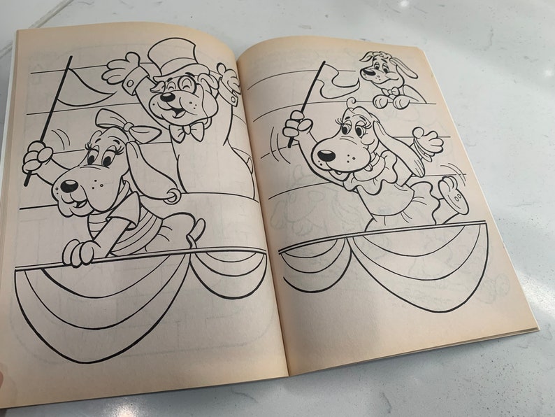 May include: Black and white line art illustration of three cartoon dogs. The dogs are wearing hats and holding flags. The dogs are standing on a stage with a curtain behind them.