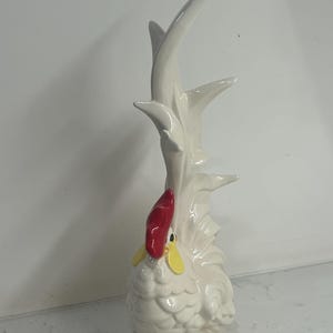 May include: A rustic wooden sign with the text "Welcome to our home" in white lettering. The sign features a distressed finish and a simple, inviting design, perfect for entryway decor.