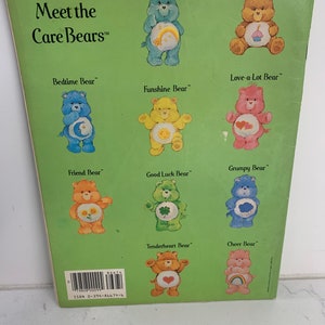 May include: A green book cover featuring the title "Meet the Care Bears" and illustrations of various Care Bears. Each bear has a distinctive colour, symbol, and name. The book cover includes the ISBN number 0-394-86674-6.