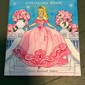 May include: A colouring book featuring a princess in a pink gown with a crown and jewellery. The book is titled "Princess Colouring Book" and has a blue background with stars. The book is by Eileen Rudisill Miller.