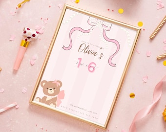May include: A framed invitation with a gold border, featuring a pink and white striped background. The invitation reads "Olivia's Sweet 16" with a teddy bear illustration and pink ribbon accents. Party decorations, including confetti and streamers, surround the invitation.