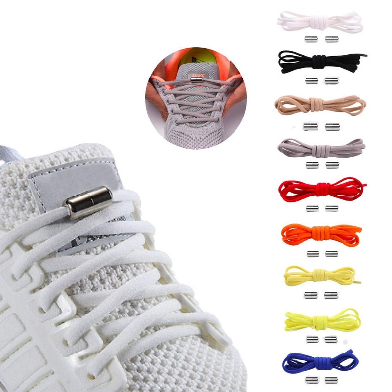 Puede incluir: Zapatillas deportivas blancas con cordones magn&eacute;ticos sin nudos. Los cordones est&aacute;n disponibles en una variedad de colores, incluyendo blanco, negro, marr&oacute;n, gris, rojo, naranja, amarillo y azul.