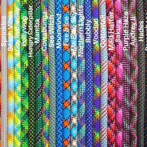 May include: A close-up of 25 different colorful rope designs with names written below each rope. The rope designs include various patterns and colors, such as red, blue, green, yellow, orange, purple, pink, and black.