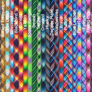May include: A collection of 20 colorful paracord ropes with various patterns, including camouflage, floral, and geometric designs. The ropes are arranged vertically and labeled with names such as "Camo", "Sandstorm", "Buried Treasure", and "Firecracker".