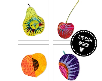 May include: Eight blank notecards with fruit illustrations, including a pear, cherry, peach, and plum. Each design is repeated twice. The cards are inspired by Northwest harvests. The text "FRUIT SALAD" is at the top.