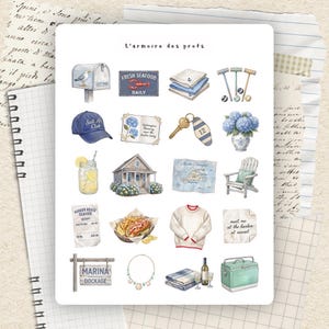 May include: A sticker sheet titled L'armoire des profs featuring coastal-themed illustrations including a mailbox, seafood sign, folded linens, croquet mallets, a blue cap, hydrangea note, key, vase, lemonade, house, map, chair, receipt, lobster roll, sweater, note, sign, necklace, wine, and cooler.