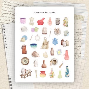 May include: A watercolour illustration featuring various pottery items, such as vases, bowls, and tools. The text "L'armoire des profs" is at the top. The colour scheme includes reds, blues, browns, and greens.