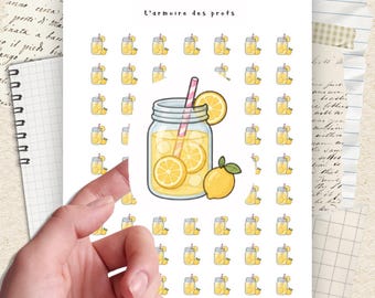 Peut inclure: Planche d'autocollants avec des illustrations de limonade dans un bocal, des tranches de citron et une paille. Les autocollants sont jaunes et blancs, avec le texte "L'armoire des profs" en haut.