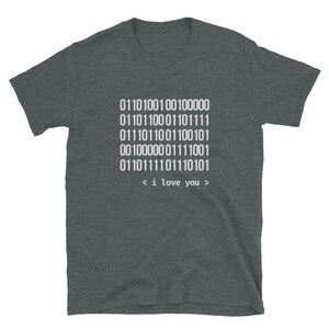 May include: A dark heather grey t-shirt with a white design of binary code that translates to "i love you".