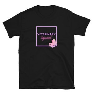 May include: Black t-shirt with a pink square and the text "VETERINARY squad" inside the square. A pink unicorn with a gold crown is in the square.