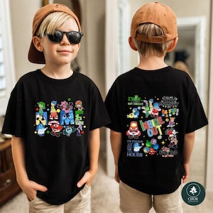 May include: A black t-shirt featuring colorful cartoon characters from the movie Inside Out. The front displays the characters around the word NAME, while the back shows various characters, the text INSIDE OUT, and other phrases.