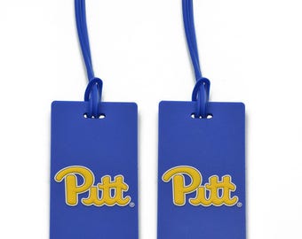 May include: Two blue luggage tags with a yellow Pitt logo. The tags have a blue strap.