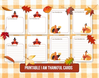 May include: Printable Thanksgiving cards featuring a cartoon turkey with a pilgrim hat. Each card has the text "I am thankful for" and a space for writing. The cards are on a checkered background with autumn leaves.
