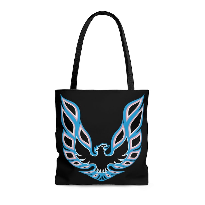 May include: Black tote bag with a blue and pink phoenix logo. The logo is a stylized bird with wings spread wide.