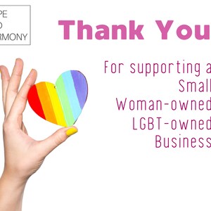 May include: A hand holding a rainbow heart with the text "Thank You" and "For supporting a Small Woman-owned LGBT-owned Business" below.