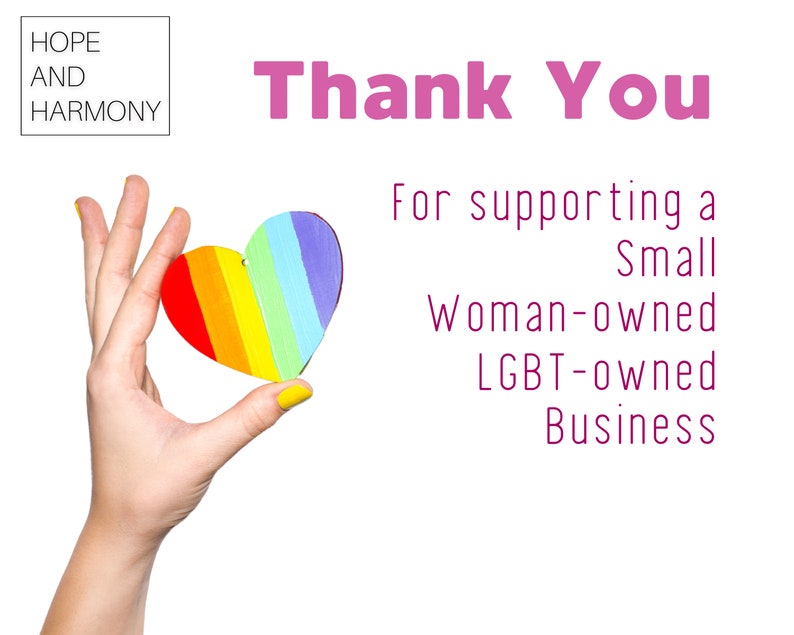 May include: A hand holding a rainbow heart with the text "Thank You" and "For supporting a Small Woman-owned LGBT-owned Business" below.