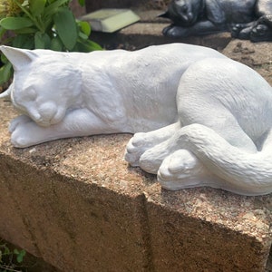 sleeping cat statue