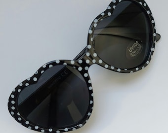 Cute, trendy sunglasses in heart shape.