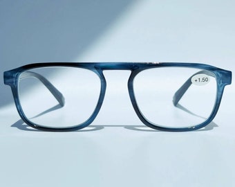 May include: Blue reading glasses with a +1.50 magnification. The glasses have a rectangular frame with a slight curve.