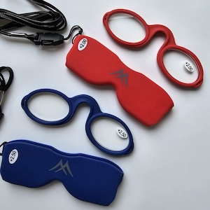May include: Red and blue reading glasses with matching cases. The glasses have a +2.00 and +2.50 magnification. Each case has a logo. A black lanyard is attached to some of the glasses.