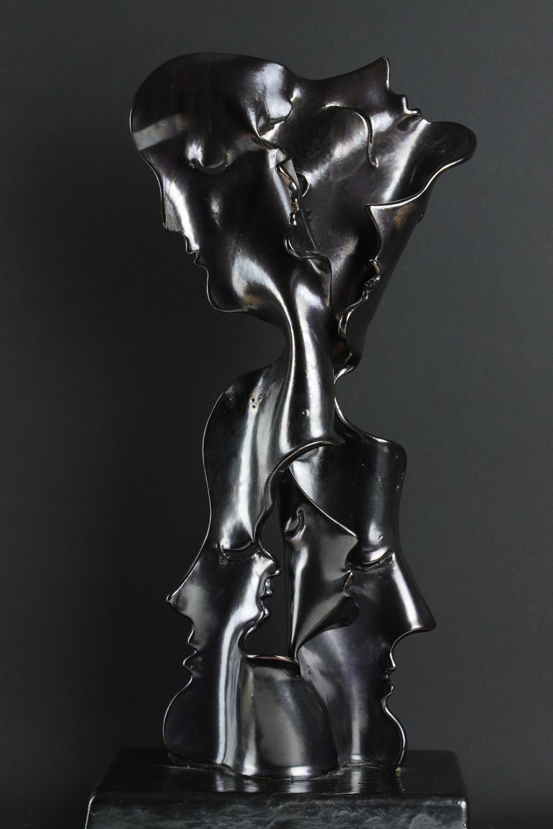 Simply Complicated: metallic ceramic sculpture with faces image 0