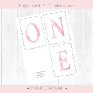 May include: Printable banner with the word "ONE" in pink watercolor letters. Each letter is on a separate card with a scalloped edge. The banner is perfect for a first birthday party.