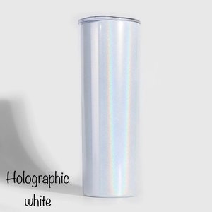 May include: A white tumbler with a holographic finish. The tumbler has a clear lid and is made of stainless steel.