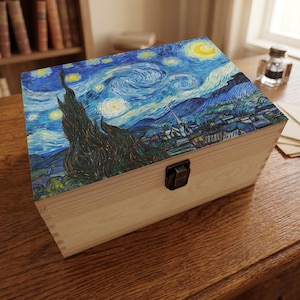 May include: A wooden box with a hinged lid, featuring a print of Vincent van Gogh's "Starry Night" painting. The box has a natural wood finish and a metal clasp. The artwork depicts a swirling night sky with a crescent moon and stars.