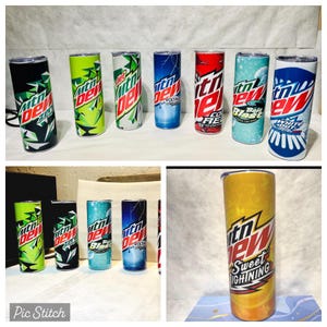 May include: A collection of 10 Mountain Dew themed stainless steel tumblers. The tumblers feature various Mountain Dew flavors and designs, including Zero, Code Red, Voltage, Baja Blast, and Sweet Lightning.
