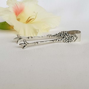 Chicken legs tongs. Sugar tongs. Silver tongs, 830 S. Antique sugar tongs. Ornate ice cube tongs. Small tongs.