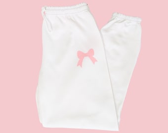 Pink Bow Sweatpants, Soft Girl Era Loungewear, Preppy Girly Outfit, White Oversized Sweats, Coquette Trendy Joggers, Cozy Lounge Pants
