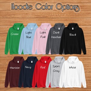 May include: A selection of ten hooded sweatshirts in various colors, including green, light blue, light pink, dark heather, black, maroon, navy, red, sport gray, and white. The text "Hoodie Color Options" is at the top of the image.