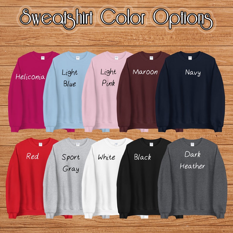 May include: A selection of ten sweatshirts in various colors, including heliconia, light blue, light pink, maroon, navy, red, sport gray, white, black, and dark heather.