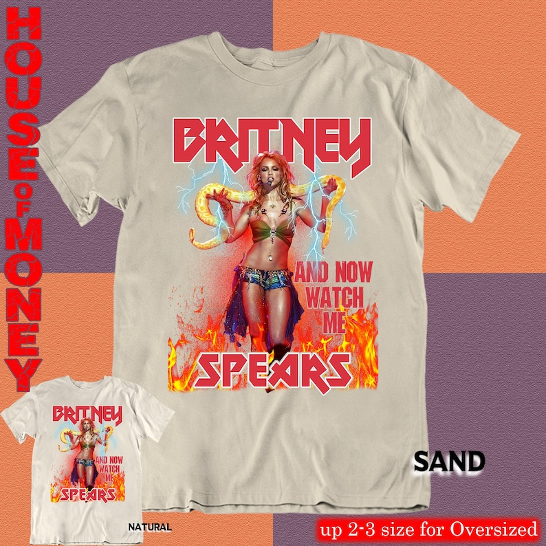 May include: Sand-colored t-shirt featuring a graphic of Britney Spears with the text "BRITNEY" in red, and "AND NOW WATCH ME SPEARS". A smaller, natural-colored shirt with the same design is also shown.
