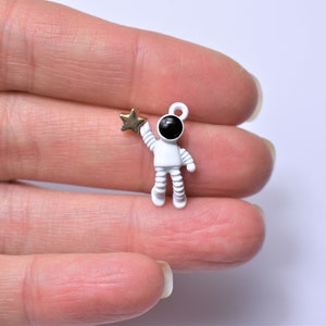 10 Astronaut charms, astronaut with star, painted alloy metal charms