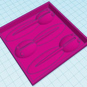 May include: A magenta-coloured mould featuring three bunny-shaped cavities. The mould is rectangular with raised edges. Each bunny has a rounded head and long, oval ears, ideal for crafting treats.