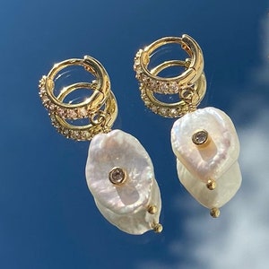 Gold hoop earrings with zircon rhinestones and cultured pearl pendants