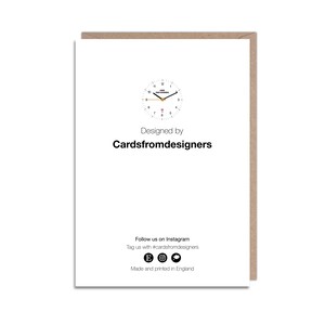 May include: A white card with black text that reads "Designed by Cardsfromdesigners". The card also features a black and white clock with a red second hand and the text "Cards from Designers" on the face.