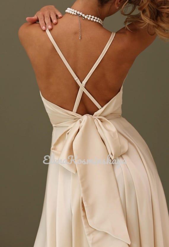 Ivory Silk Midi Dress: Sleeveless Bow Gown, Deep V-Neck