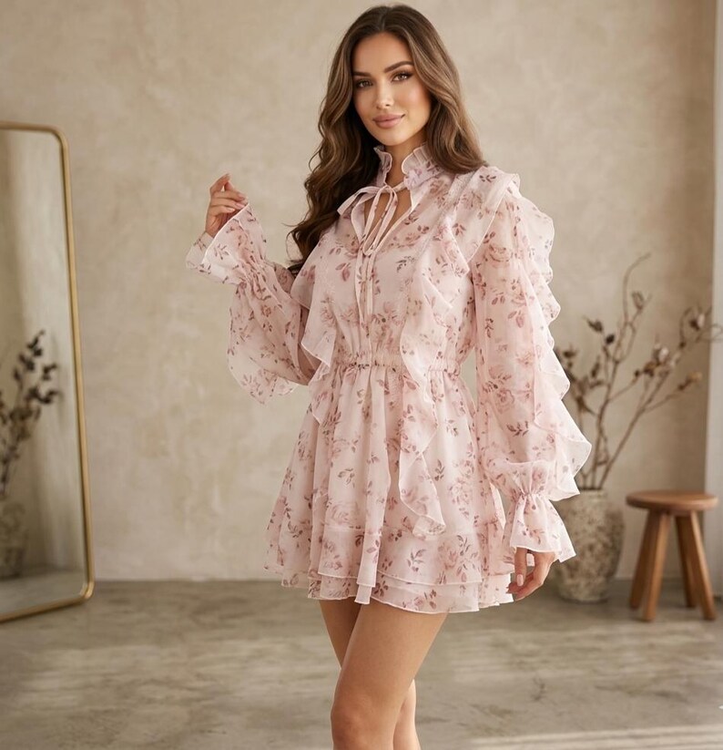 ​Discover this romantic floral Tencel mini dress featuring exquisite French lace inserts and dramatic cascading ruffles. Perfect for special occasions, romantic dates, or creating a charming cottagecore look that stands out.