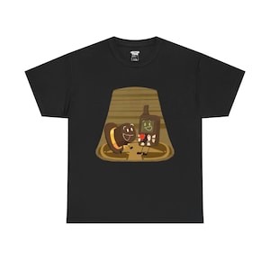 May include: A black t-shirt with a cartoon image of a brown hat and a green bottle holding hands inside a brown wooden cabin.