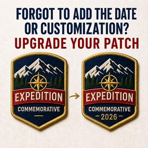May include: Two shield-shaped embroidered patches featuring a mountain range, pine trees, and a gold compass. The text reads: FORGOT TO ADD THE DATE OR CUSTOMIZATION? UPGRADE YOUR PATCH. EXPEDITION COMMEMORATIVE is on both, with 2026 added to the right patch.