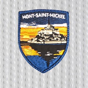 Broderad lapp i Mont-Saint-Michel – Normandies landmärkesmärke, Frankrikes reselapp, medeltida klostersköldlapp