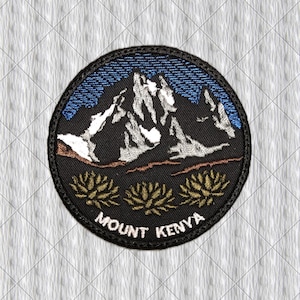 May include: A circular embroidered patch featuring a dark mountain range with white snow-capped peaks against a blue sky. The foreground displays three golden-brown plant motifs above the white embroidered text that reads MOUNT KENYA.