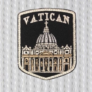 May include: Embroidered patch featuring the word "VATICAN" above a detailed illustration of St. Peter's Basilica. The patch is black with beige and silver accents, and a beige border. The patch is shield-shaped.